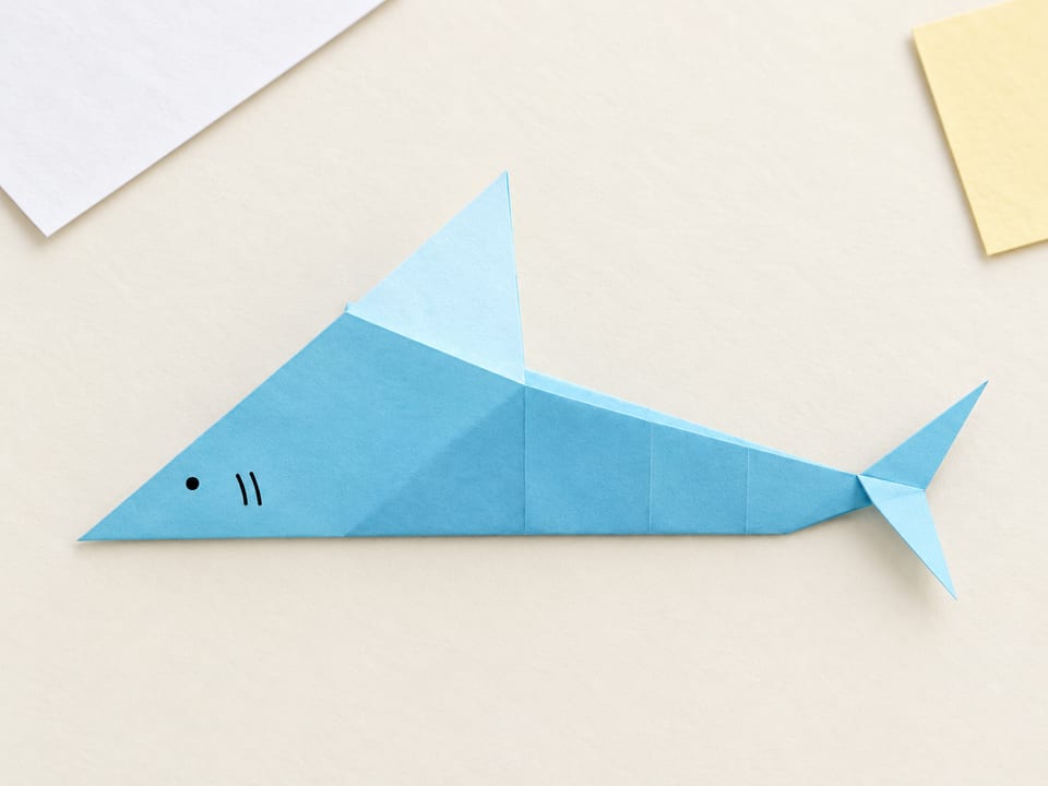 Finished origami shark, folded from a simple sheet of paper